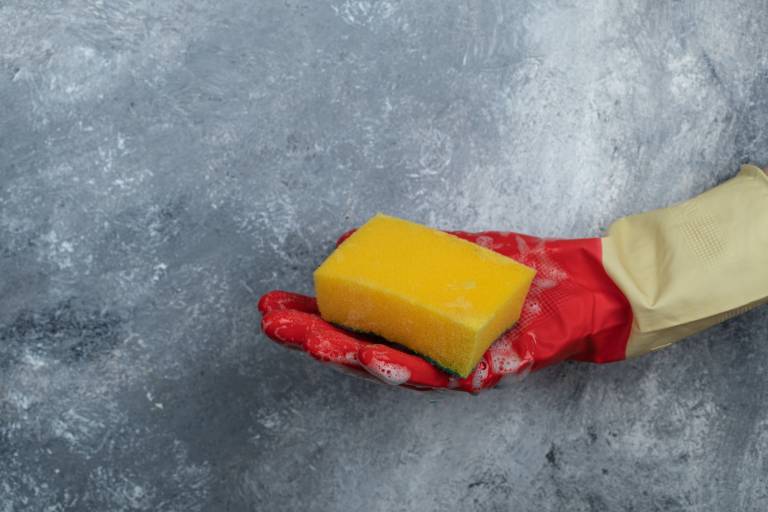 Sponge and gloves for cleaning walls before painting
